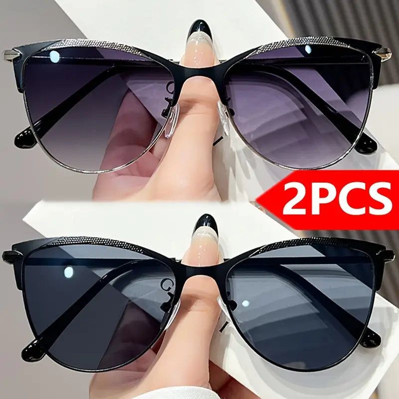 نظارات شمسية نسائية عصرية بتصميم عين القطة - حماية من الأشعة فوق البنفسجية 400، إطار معدني أسود مع عدسات أرجوانية متدرجة.